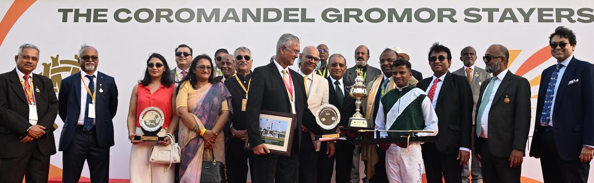 Arun Alagappan presenting the Coromandel Gromor Stayers Cup to trainer Bharat Singh in the presence of the owners Joydeep Datta Gupta, Achuthan Siddharth, jockey A. Sandesh, the Madras Race Club chairman Muthiah Ramaswamy, and others.